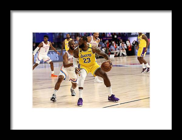 Nba Pro Basketball Framed Print featuring the photograph Chris Paul and Lebron James by Joe Murphy