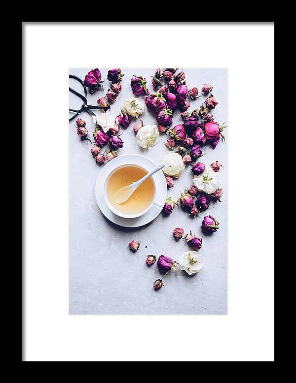Fragility Framed Print featuring the photograph Cup of herbal tea with dried roses #1 by JuliaK