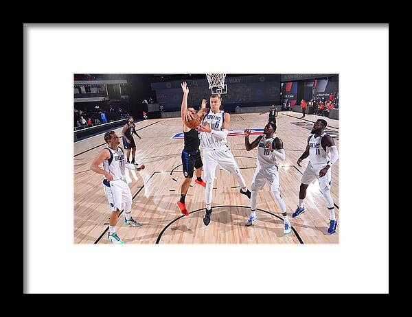 Kristaps Porzingis Framed Print featuring the photograph Dallas Mavericks v LA Clippers - Game One by David Sherman