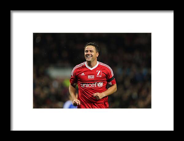 Unicef Framed Print featuring the photograph David Beckham Match for Children in aid of UNICEF #1 by Matthew Ashton - AMA