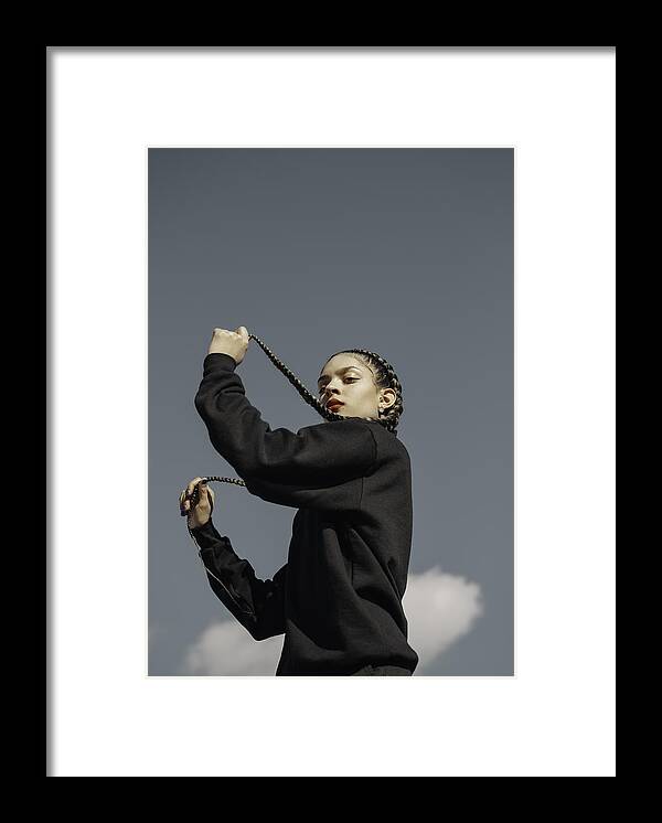 Hipster Culture Framed Print featuring the photograph Female Model photographed against sky backdrop #1 by Evelyn Hoffman