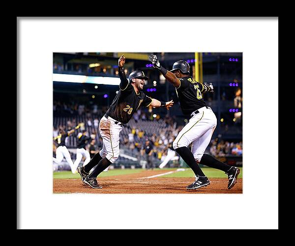 People Framed Print featuring the photograph Francisco Cervelli and Gregory Polanco #1 by Jared Wickerham