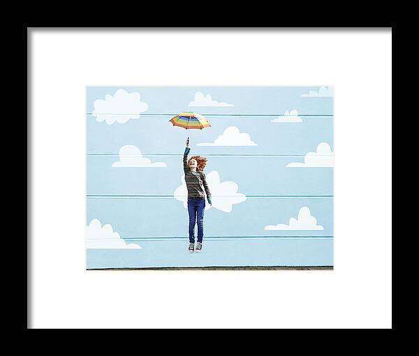 Child Framed Print featuring the photograph Girl jumping with umbrella #1 by Flashpop