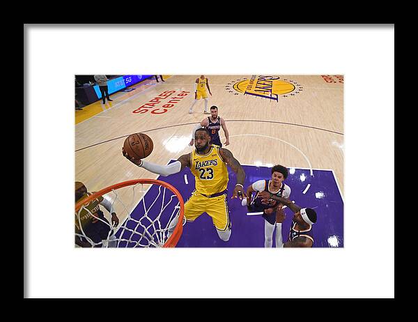 Lebron James Framed Print featuring the photograph Lebron James by Juan Ocampo