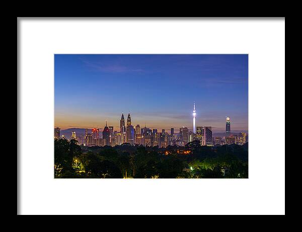Majestic Framed Print featuring the photograph Majestic sunrise over downtown Kuala Lumpur, Malaysia #1 by Shaifulzamri