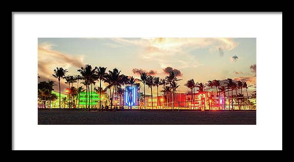 Miami Beach Framed Print featuring the photograph Miami Beach Ocean Drive panorama with hotels and restaurants at sunset. City skyline with palm trees at night. Art deco nightlife on South beach by Maria Kray