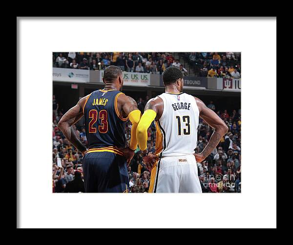 Lebron James Framed Print featuring the photograph Paul George and Lebron James by Ron Hoskins