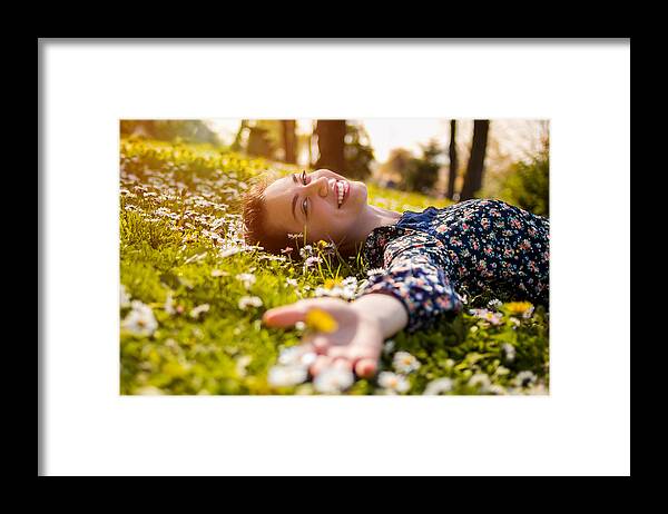 White People Framed Print featuring the photograph Pretty young teenage girl relaxing on a grass #1 by Hobo_018