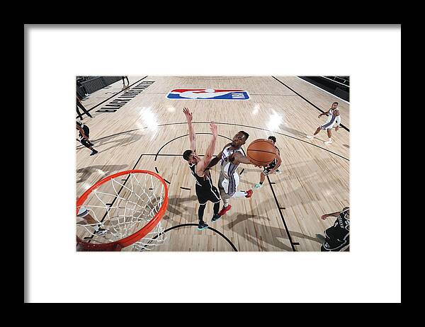 Nba Pro Basketball Framed Print featuring the photograph Sacramento Kings v Brooklyn Nets by David Sherman
