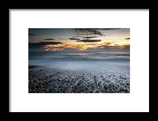 Seascape Framed Print featuring the photograph Seawaves splashing on the coast during a dramatic sunset #2 by Michalakis Ppalis
