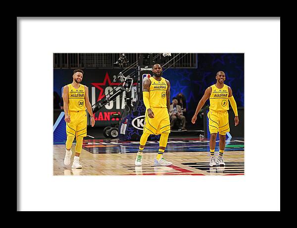 Stephen Curry Framed Print featuring the photograph Stephen Curry, Chris Paul, and Lebron James by Joe Murphy