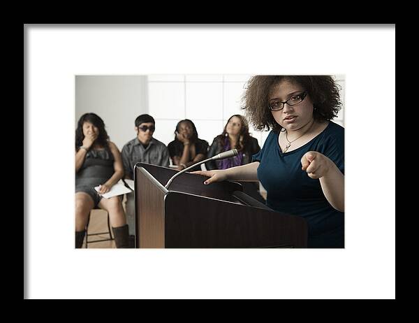Debate Framed Print featuring the photograph Teenage girl giving speech to classmates #1 by Hill Street Studios
