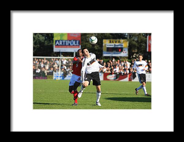 International Match Framed Print featuring the photograph U16 Germany v U16 England - International Friendly #1 by Getty Images