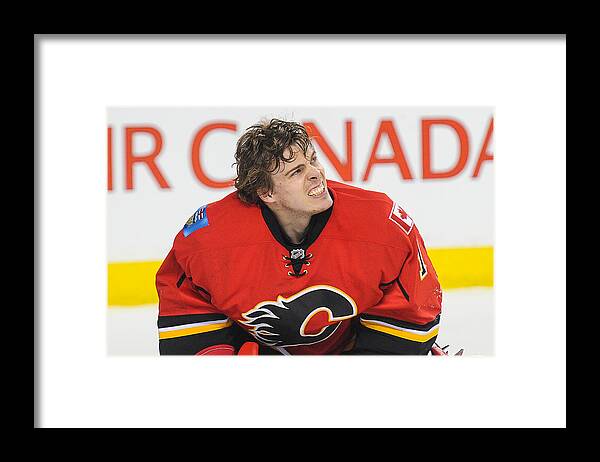 Playoffs Framed Print featuring the photograph Vancouver Canucks v Calgary Flames - Game Three #1 by Derek Leung