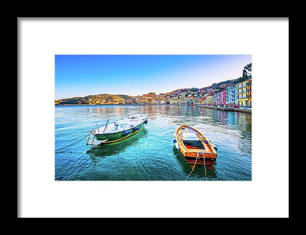 Porto Framed Print featuring the photograph Wooden small boats in Porto Santo Stefano seafront. Argentario, #1 by Stefano Orazzini