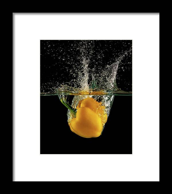 Pepper Framed Print featuring the photograph Yellow bell pepper dropped and slashing on water by Michalakis Ppalis