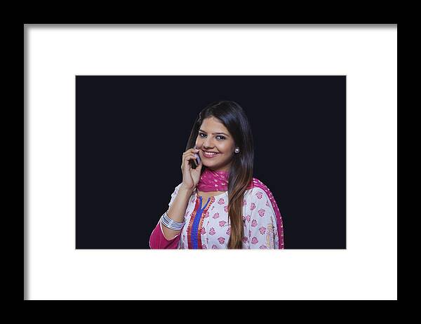 People Framed Print featuring the photograph Young woman talking on her mobile phone #1 by Ravi Ranjan
