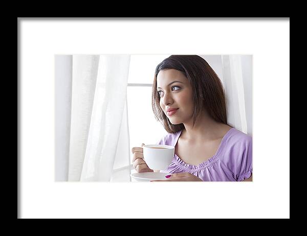 People Framed Print featuring the photograph Young woman with a cup of coffee #1 by Ravi Ranjan