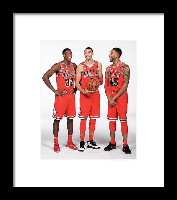 Kris Dunn Framed Print featuring the photograph Zach Lavine, Kris Dunn, and Denzel Valentine by Randy Belice