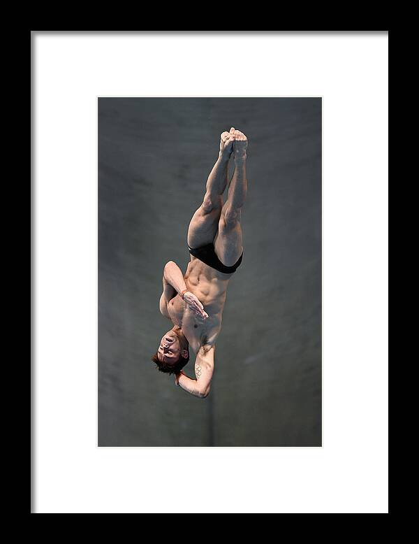 Diving Into Water Framed Print featuring the photograph FINA/NVC Diving World Series #16 by Michael Regan