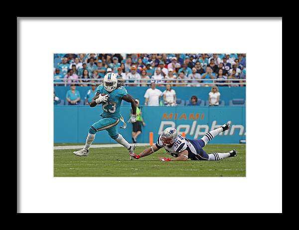 Miami Gardens Framed Print featuring the photograph New England Patriots v Miami Dolphins #16 by Joel Auerbach