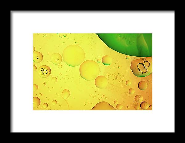 Fluid Framed Print featuring the photograph Abstract, image of oil, water and soap with colourful background by Michalakis Ppalis