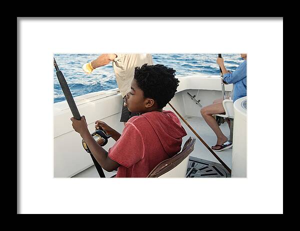 Summer Framed Print featuring the photograph African-american boy on a sea fishing trip. #2 by Martinedoucet