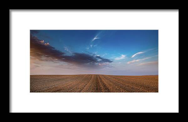 Nightfall Framed Print featuring the photograph Agricultural meadow field and cloudy sky during sunset. by Michalakis Ppalis