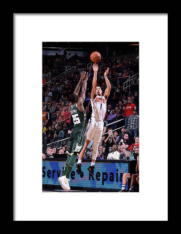 Devin Booker Framed Print featuring the photograph Devin Booker by Michael Gonzales