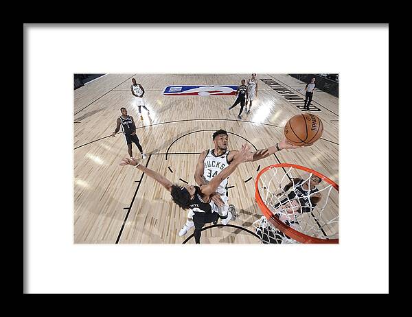 Giannis Antetokounmpo Framed Print featuring the photograph Giannis Antetokounmpo by David Sherman