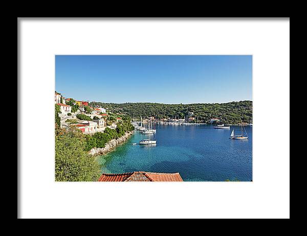 Kioni Framed Print featuring the photograph Kioni in Ithaki island, Greece #2 by Constantinos Iliopoulos