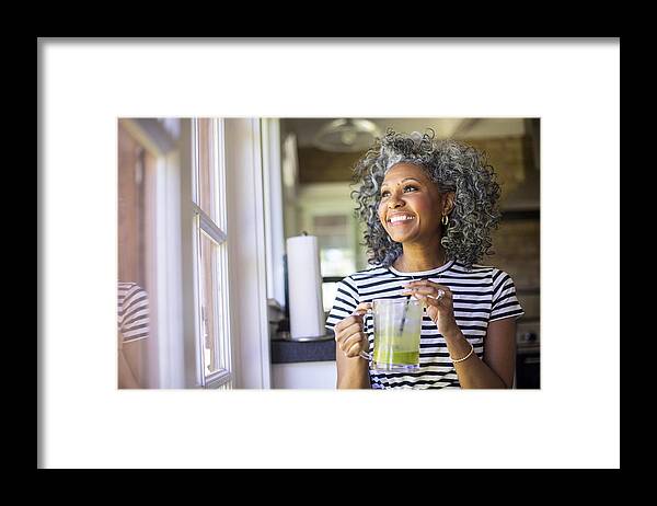 Tranquility Framed Print featuring the photograph Mature Black Woman Drinking a Green Smoothie #2 by Adamkaz
