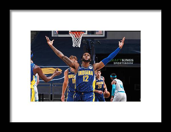 Oshae Brissett Framed Print featuring the photograph Play-In Tournament - Charlotte Hornets v Indiana Pacers by Ron Hoskins