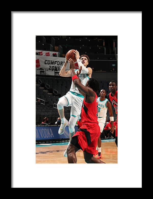 Nba Pro Basketball Framed Print featuring the photograph Toronto Raptors v Charlotte Hornets by Kent Smith