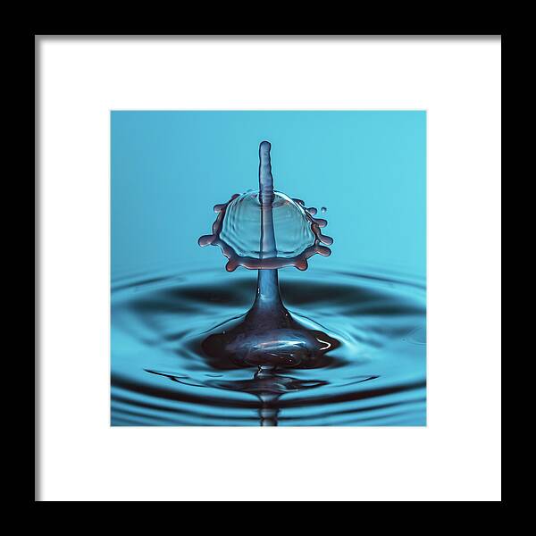 Waterdrop Framed Print featuring the photograph Water drop falling onto column of water by Steven Heap