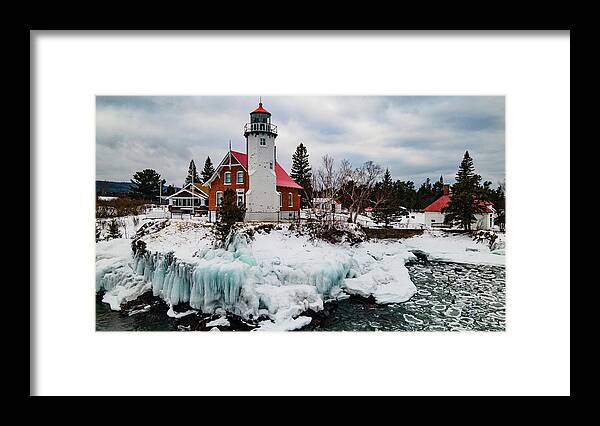 Eagle Harbor Mi Framed Print featuring the photograph Winter view of Eagle Harbor Lighthouse in Eagle Harbor Michigan #21 by Eldon McGraw
