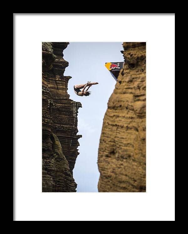 Diving Into Water Framed Print featuring the photograph Red Bull Cliff Diving World Series 2015 #29 by Handout