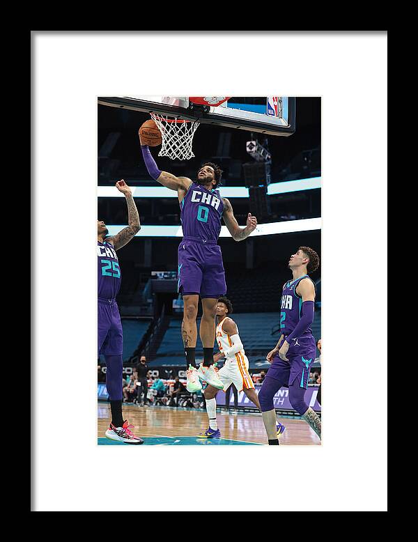 Miles Bridges Framed Print featuring the photograph Atlanta Hawks v Charlotte Hornets by Brock Williams-Smith