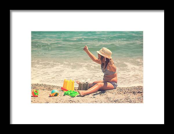 Water's Edge Framed Print featuring the photograph Beautiful Little Girl at The Beach #4 by Kajakiki