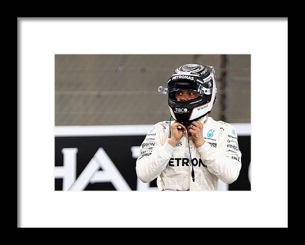 Mercedes Amg Petronas Formula One Team Framed Print featuring the photograph F1 Grand Prix of Abu Dhabi - Qualifying #4 by Mark Thompson