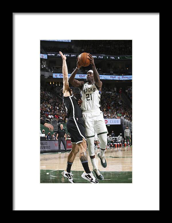 Playoffs Framed Print featuring the photograph Jrue Holiday by Gary Dineen