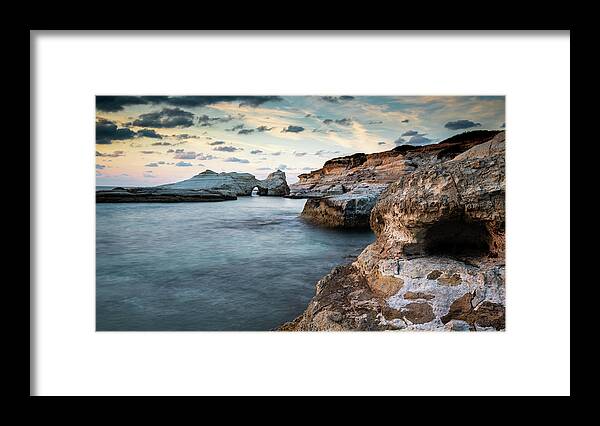 Seascape Framed Print featuring the photograph Rocky seashore seascape with dramatic and beautiful sunset. by Michalakis Ppalis