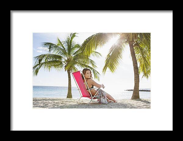 White People Framed Print featuring the photograph Woman relaxing on beach lounger #4 by Felix Wirth