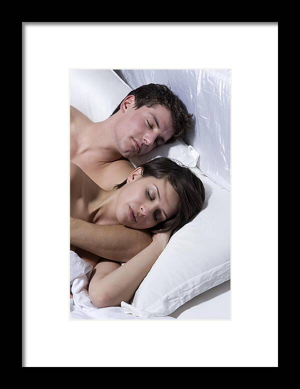 Young Men Framed Print featuring the photograph Young Couple Sleeping On Bed #4 by B2M Productions
