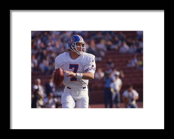1980-1989 Framed Print featuring the photograph Denver Broncos v Los Angeles Raiders #6 by Owen C. Shaw