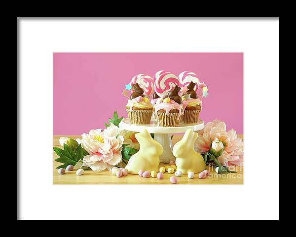 Easter Framed Print featuring the photograph Easter theme candy land drip cupcakes in party table setting. #7 by Milleflore Images