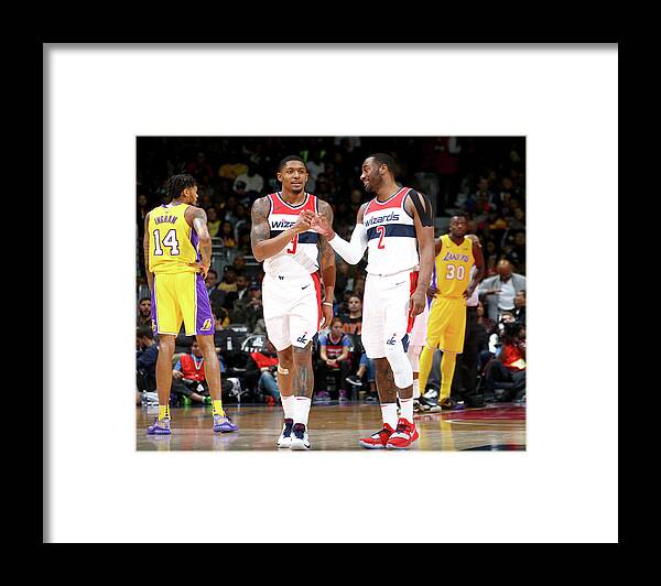 Nba Pro Basketball Framed Print featuring the photograph John Wall and Bradley Beal by Ned Dishman