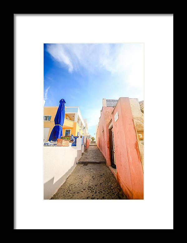 Scenics Framed Print featuring the photograph A blue and white Oia village on Santorini island, Mediterranean, Greece by Zcenerio
