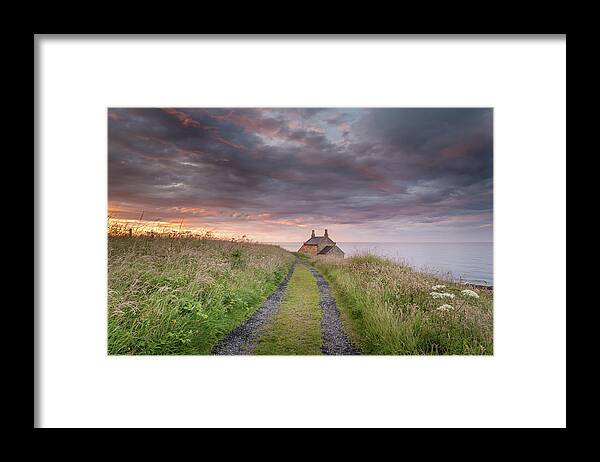 Northumberland Framed Print featuring the photograph A cottage by the sea by Anita Nicholson