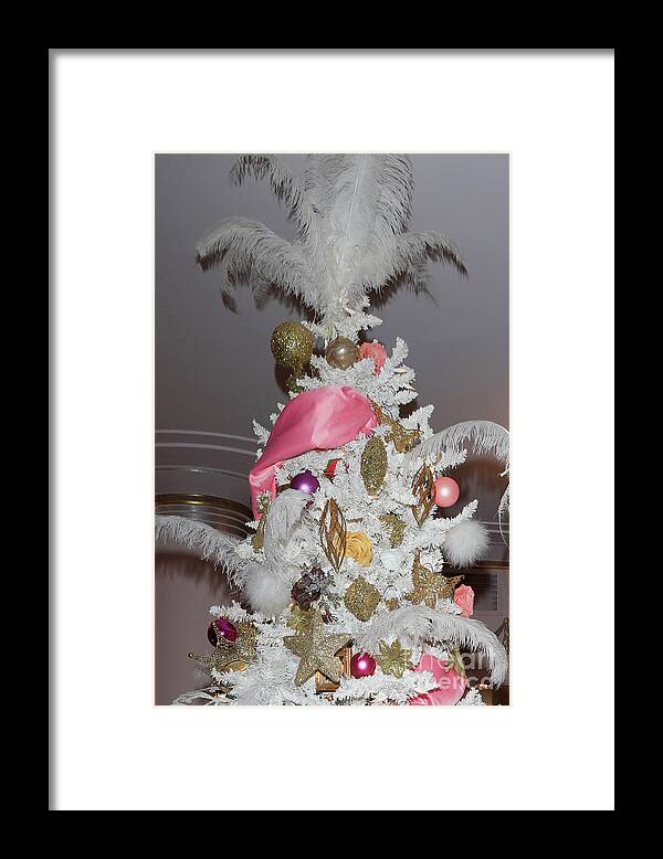 A Feathery Christmas Tree Topper Framed Print featuring the photograph A feathery Christmas tree topper by Nina Prommer